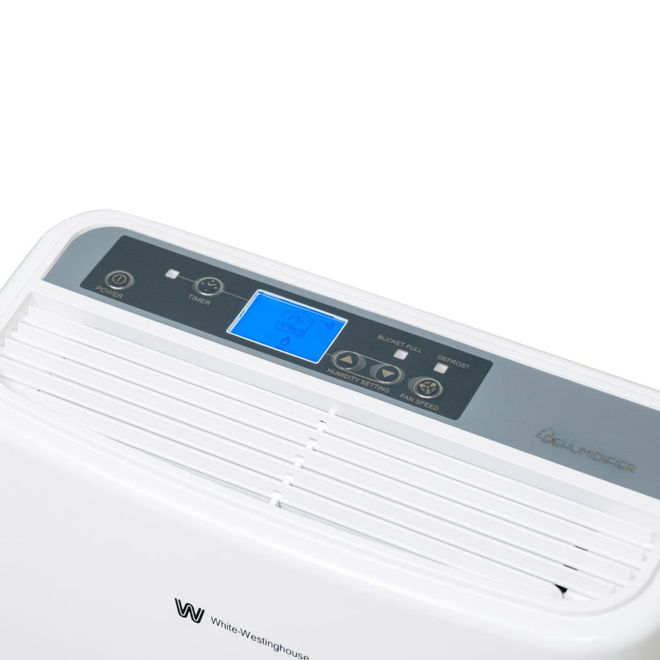White Westinghouse AWHD-20L dehumidifier by JET INDIA showing a compact appliance with digital controls and air vents.