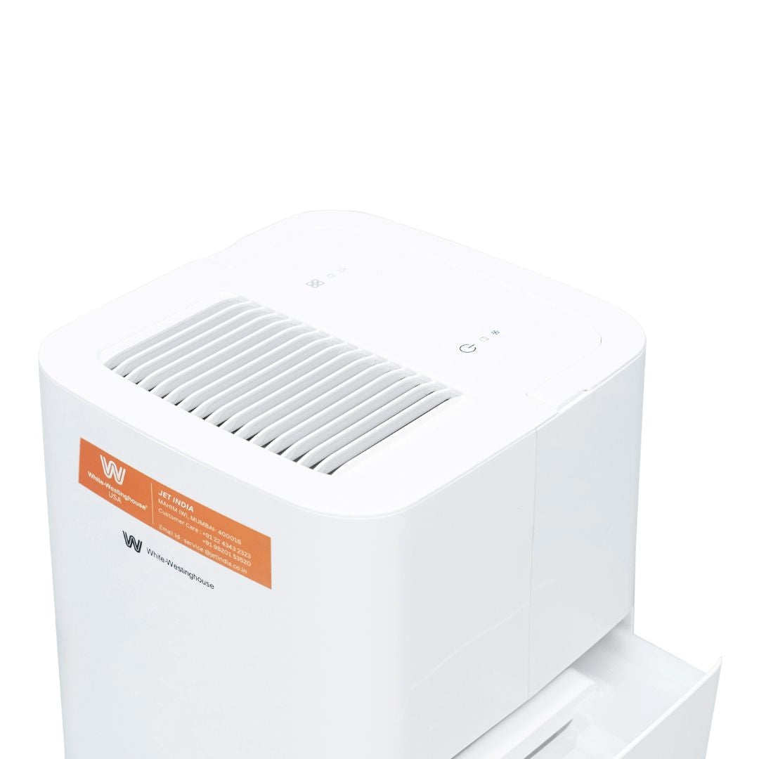 White Westinghouse AWHD-12L dehumidifier by JET INDIA showing front view with digital controls and water collection tank.