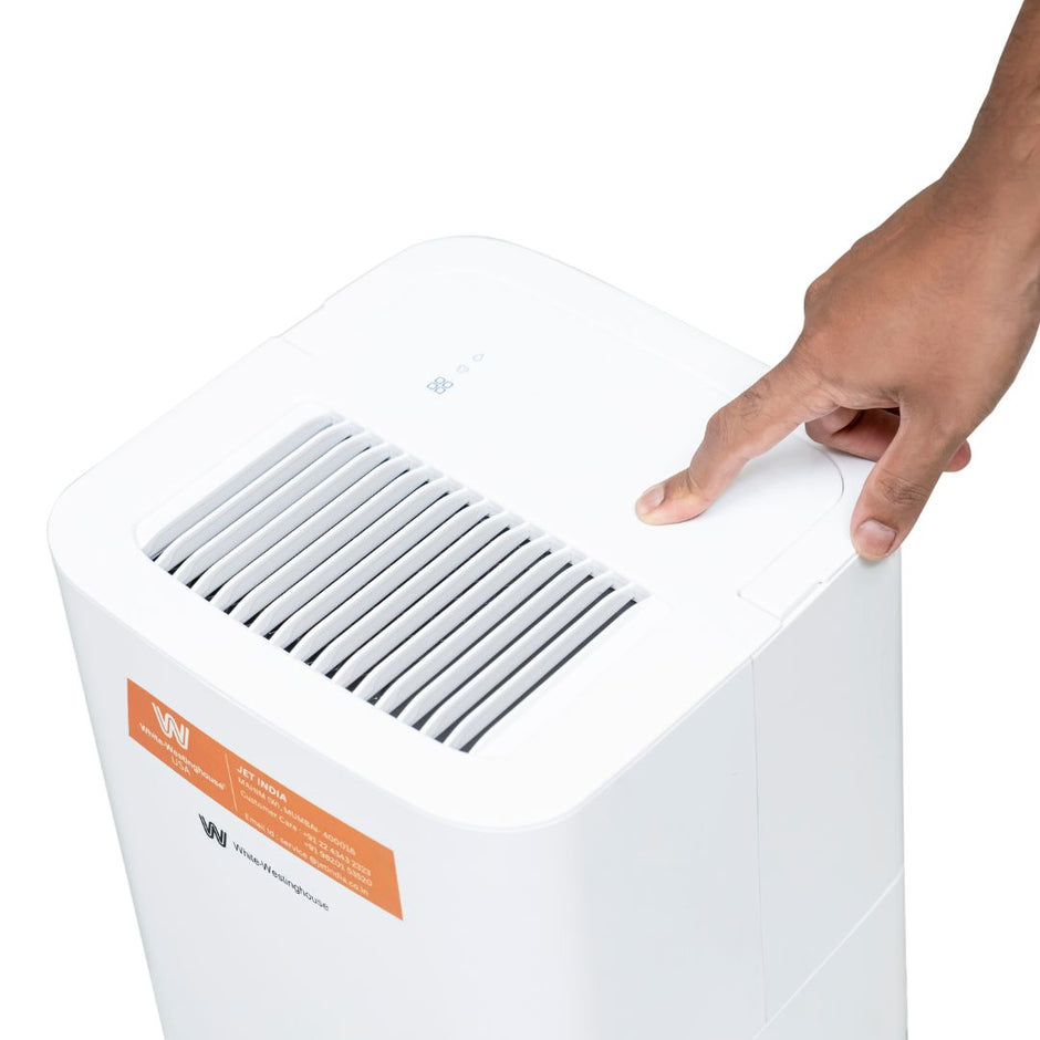 White Westinghouse AWHD-12L dehumidifier by JET INDIA, showing a compact appliance with control panel and air vents.
